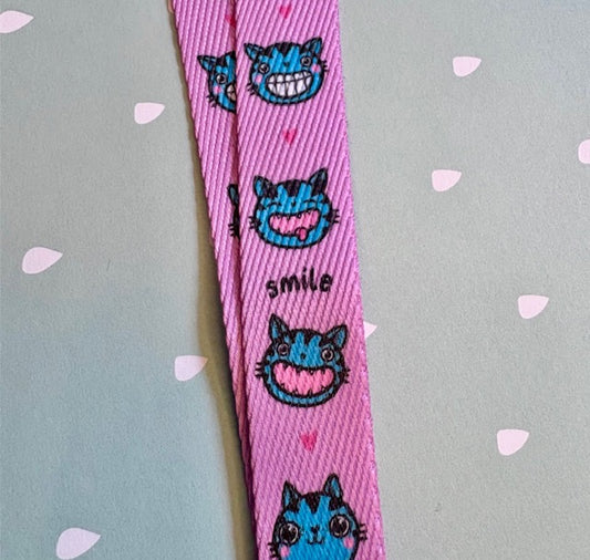 Taina - Schlüsselband "Smile" pink