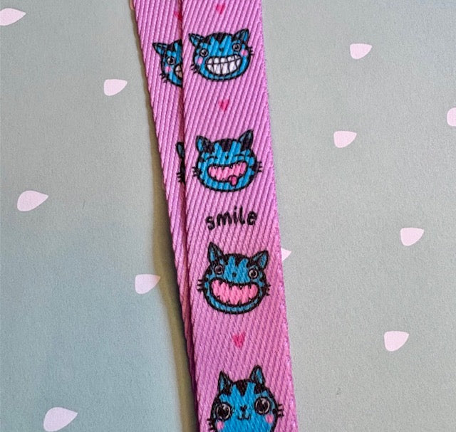 Taina - Schlüsselband "Smile" pink